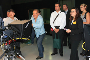 Prof Scarlet Tso (second right) showed the delegation the TV studio of the School of Communication