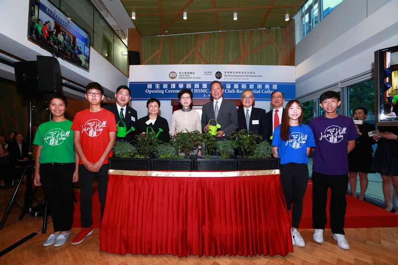 A group photo of officiating guests and student residents from the four RCs