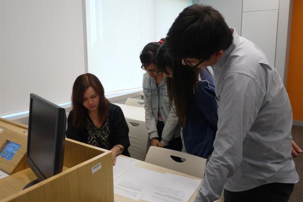 Students working on financial translation proofreading assignment