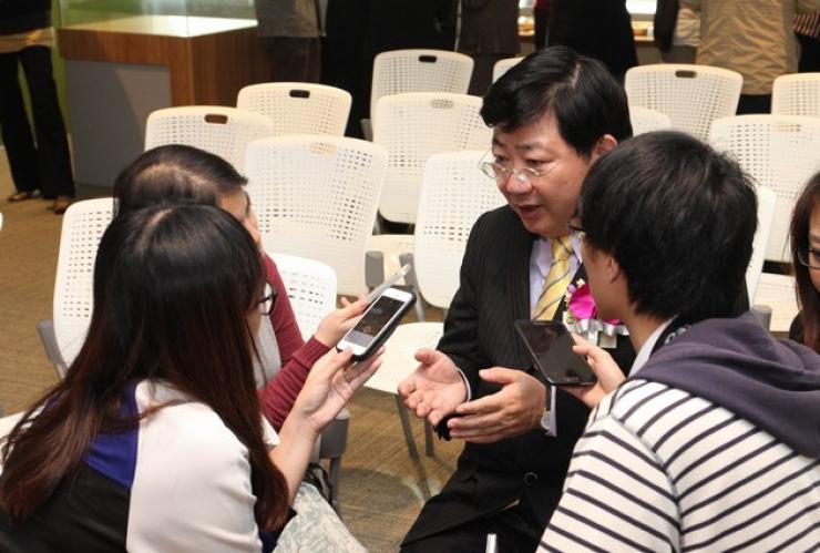 Reporters interviewing Prof Simon Ho after the ceremony