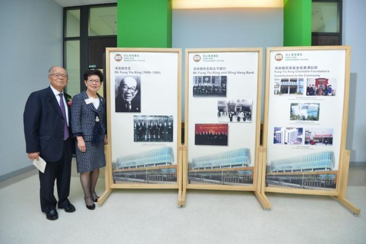 Mrs Judy Ho and Mr Louis Ho with the commemorative plaque and display boards which introduced Mr Fung Yiu King and Fung Yiu King Charitable Foundation’s contributions to the community