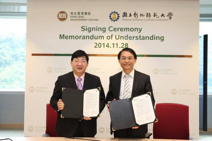 Prof Simon Ho and Prof Yen-Kuang Kuo (right) at the signing ceremony