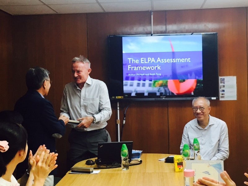 Professor Luk presents Dr Arthur McNeill (HKUST) with a souvenir from the Department of English