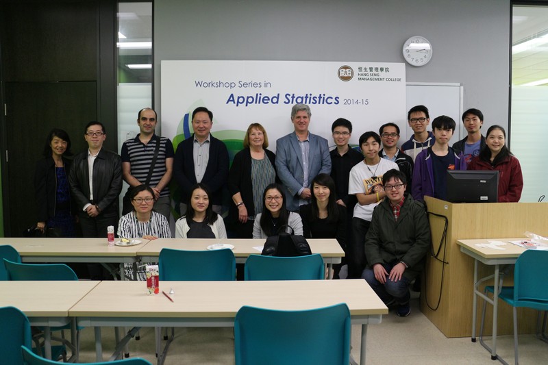 A group photo of the participants and the speakers