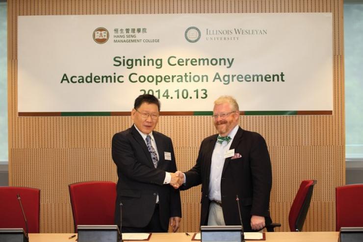 Prof Gilbert Fong and Prof Jonathan Green (right) at the signing ceremony
