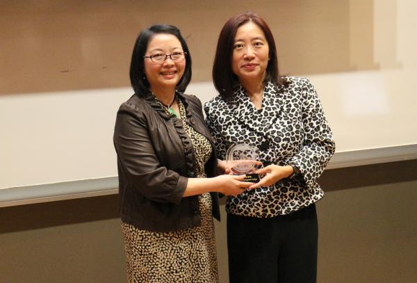 Ms Joanna Kwok presented a souvenir to Ms Evangeline Ho, General Manager of Nova Training & Education Institute (left)