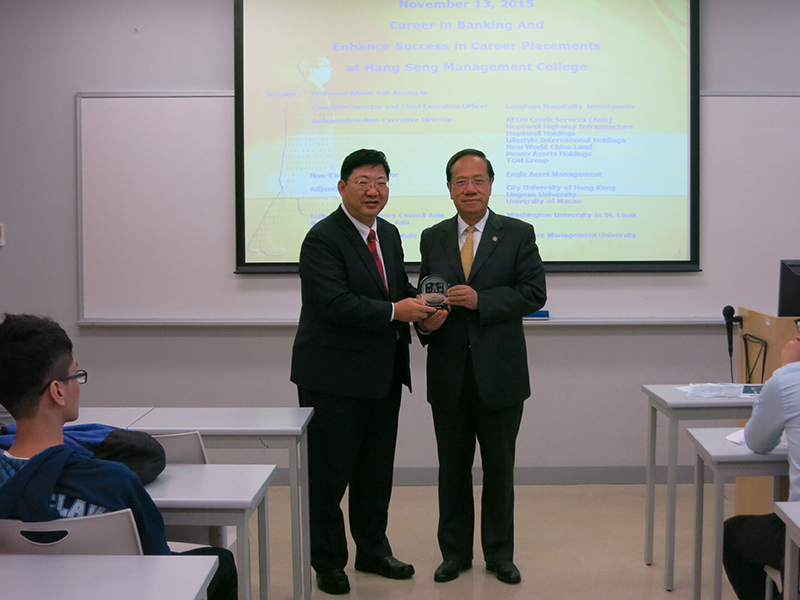 President Simon S M Ho presented a souvenir to Professor Yip