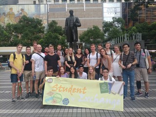 Taking a group photo at the Statue Square in Central