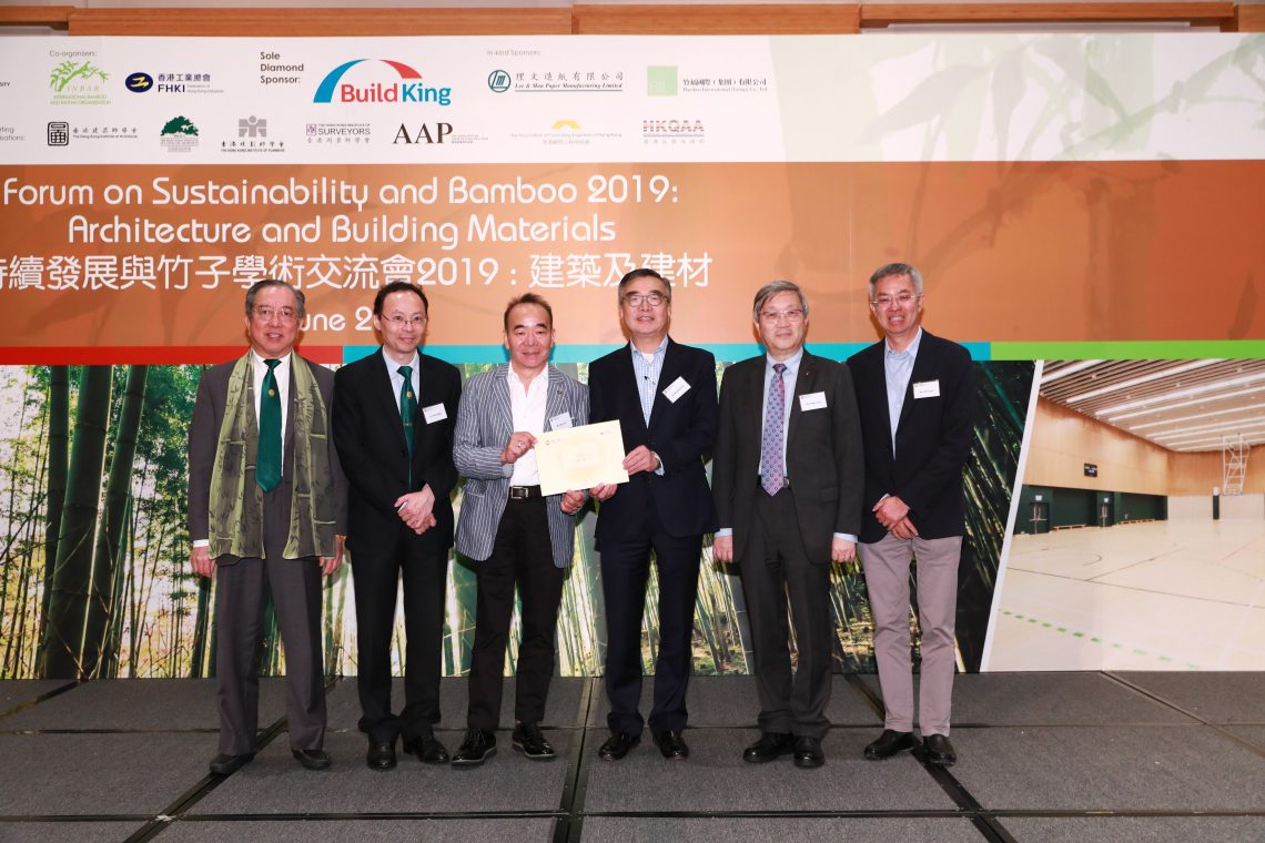 Mr Martin Tam and Dr Tom Fong jointly presenting souvenir with 3 Vice-Chairmen of FHKI-BIC to a representative of Bamboo International (Group) Co., Ltd.