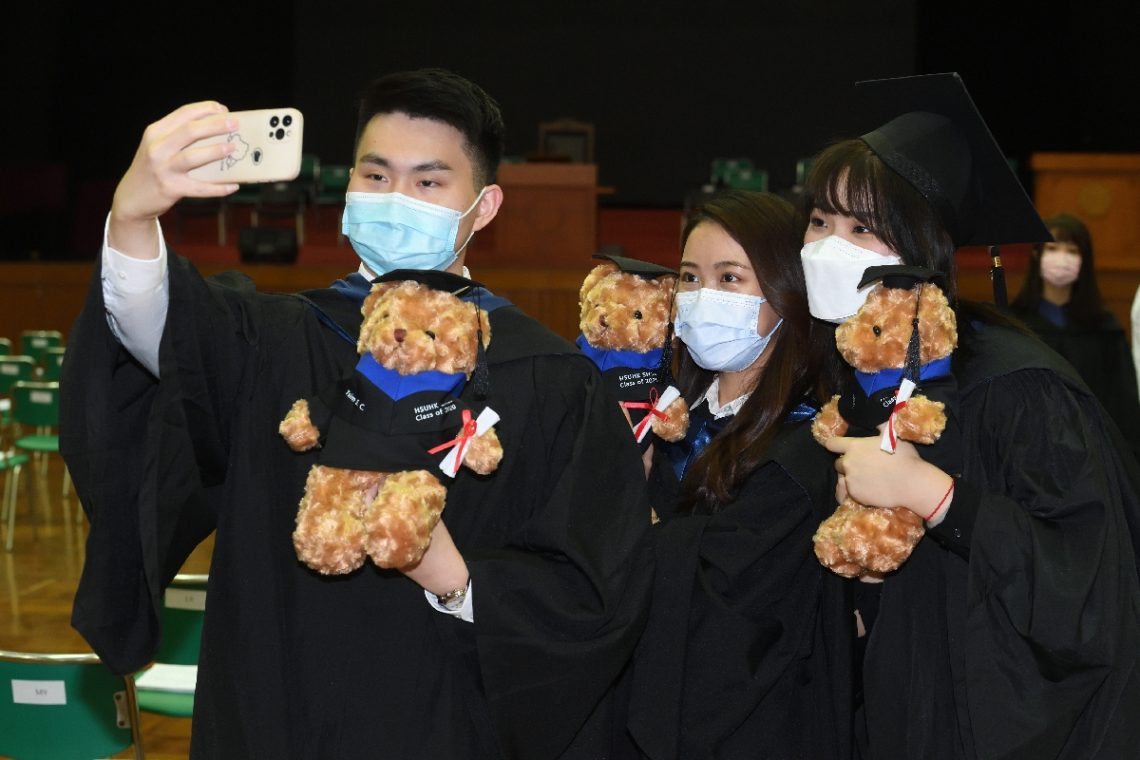 Graduates took photos with their personalised graduation bear, a gift from the School.