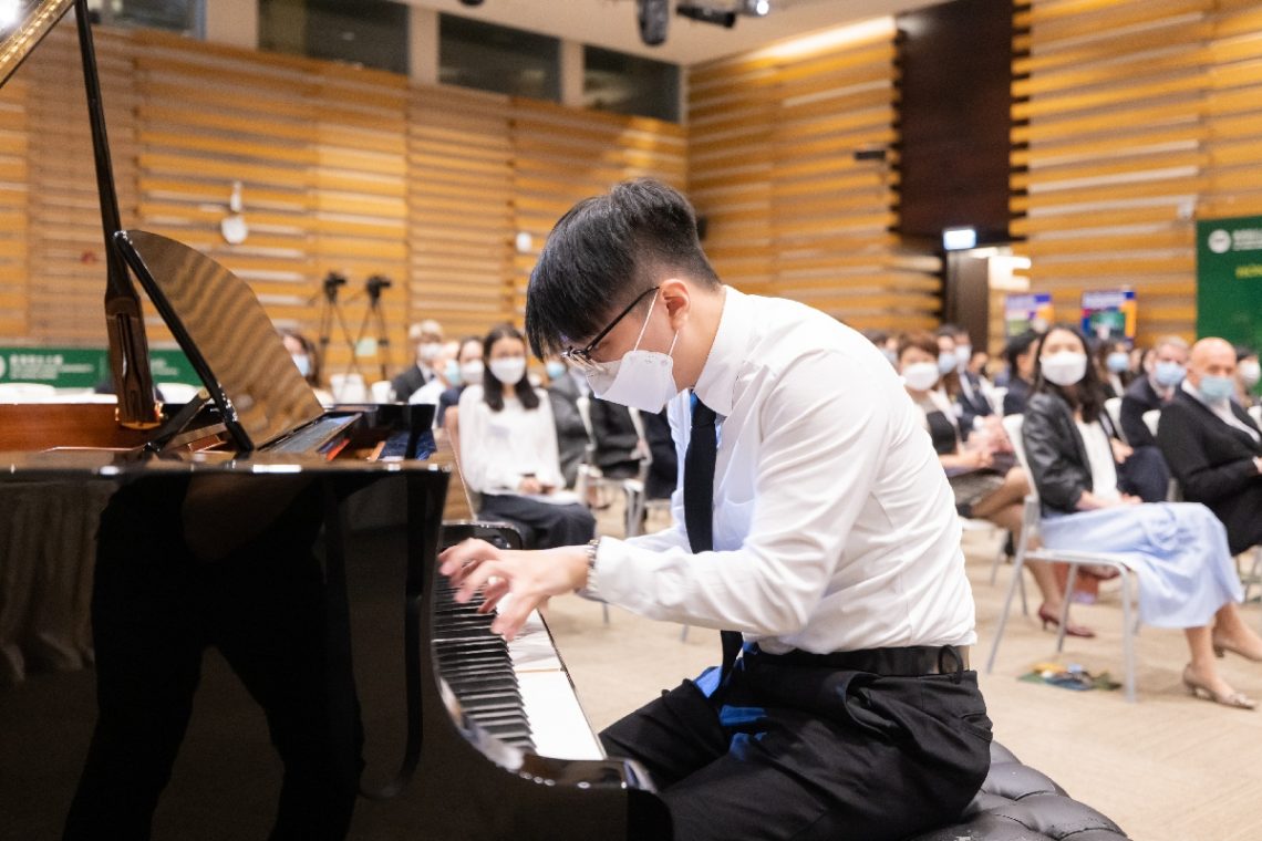 Mr Tom Tang from the first cohort concludes the Ceremony with another piano recital, Pirates of the Caribbean.