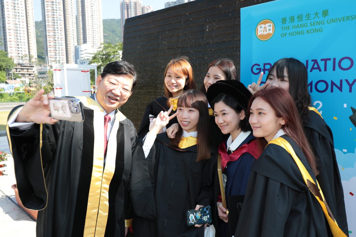 President Simon Ho congratulates graduates.