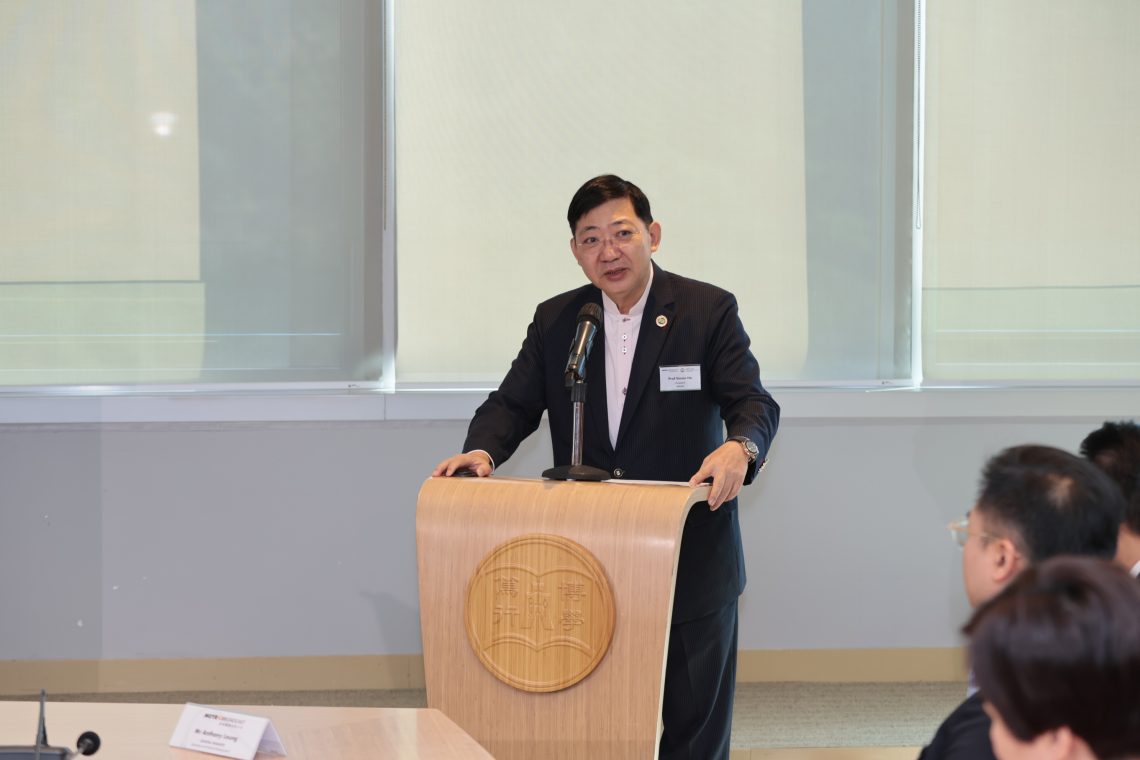Photo 2: Professor Simon S M Ho gave a welcome speech on the signing ceremony